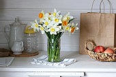 still-life, bouquet of daffodils, garden flowers. concept: spring, rural composition, cottage core.