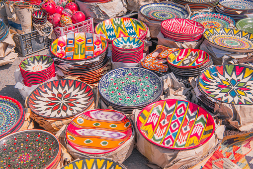 Colorful plates and pots at Chorsu bazaar, Tashkent, Uzbekistan. Background image, colorful souvenirs