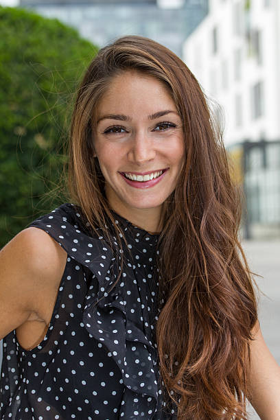 istock beautiful young woman smiling 180514216
