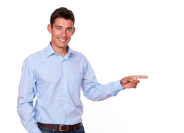 istock Adult man smiling and pointing to his left. 180515091
