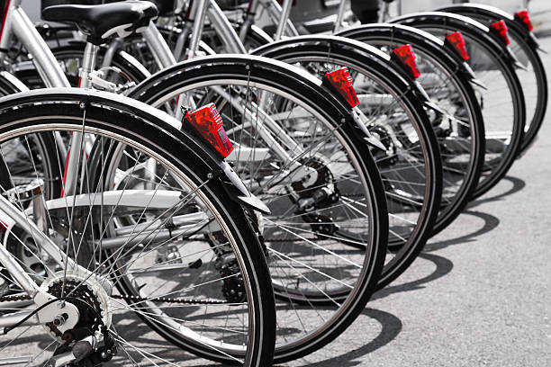 istock Bicycles stand in a row on parking for rent 180517476