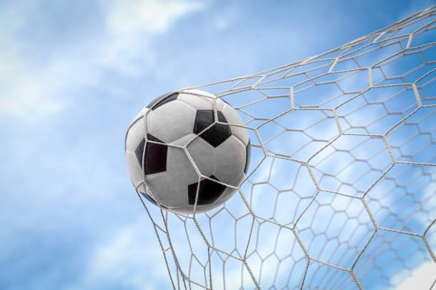 istock soccer ball on goal with net background 1805188757
