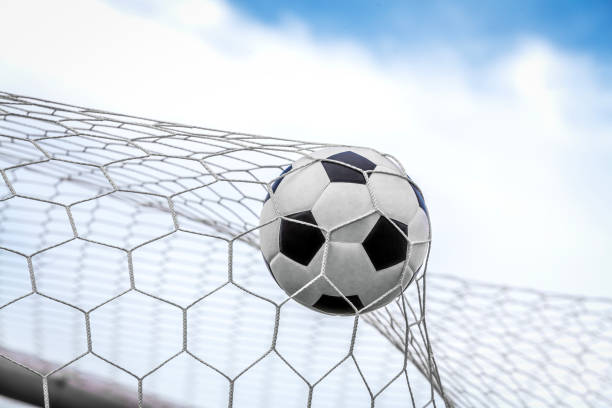 istock soccer ball on goal with net background 1805189280