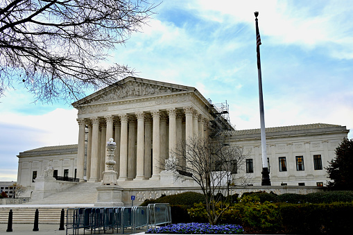 Washington, D.C., USA - November 20, 2023: Scaffolding is seen on the side of the Supreme Court of the United States (SCOTUS) on a late autumn afternoon.