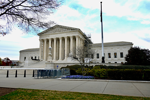 Washington, D.C., USA - November 20, 2023: Scaffolding is seen on the Supreme Court of the United States (SCOTUS) on a late autumn afternoon.