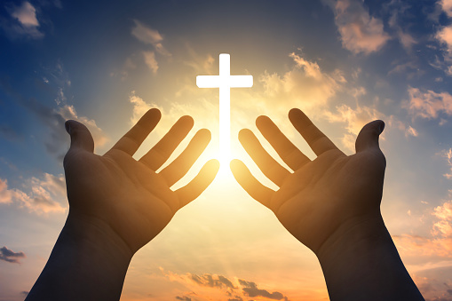 prayer concept, Human hands open palm up to worship god Jesus Christ  on cross background