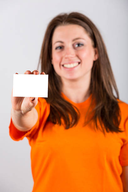 istock Young Woman Holding Blank Card 180522304