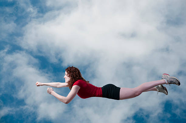 istock Woman Flying Through the Sky 180522651