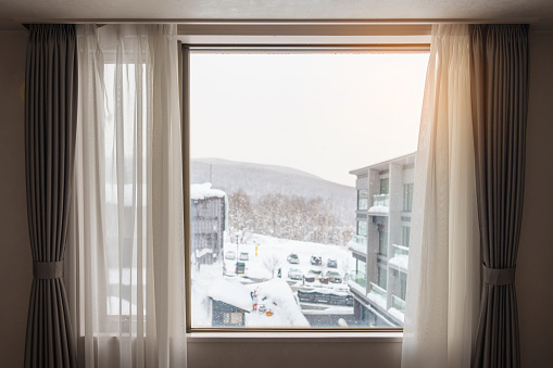 window and curtain in winter season at apartment or hotel in the morning. Lifestyle and Relaxing concepts