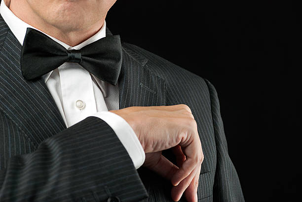 istock Man Wearing Tux Tucks In Pocket Square 180525335