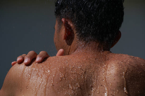 istock asian men take a bath and water splashing. 1805266402