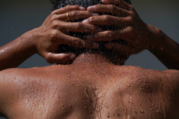 asian men take a bath and water splashing.