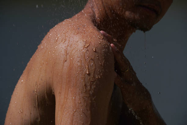 istock asian men take a bath and water splashing. 1805266542