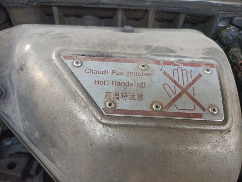 Warning image on car engine. Image instructions do not touch the car engine