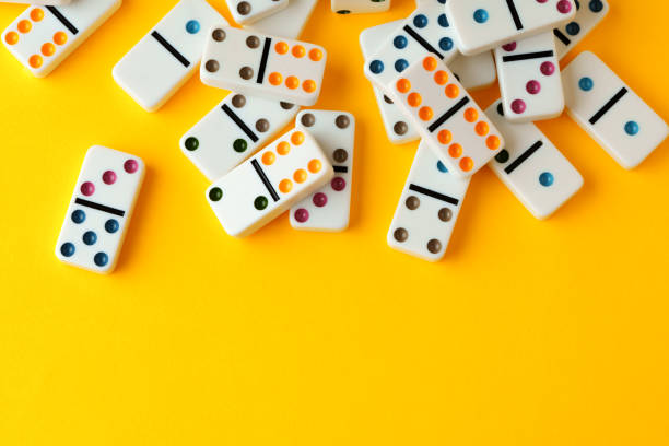 istock Domino tiles on yellow background studio shot 1805285145