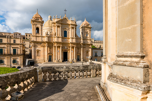Noto,Italy-May 8, 2022:View of the beautiful Cathedral of Noto from the terrace of the Palazzo Ducezio during a sunny day