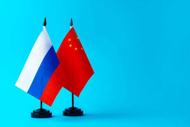 istock Flags of Russia and China on blue background 1805292013