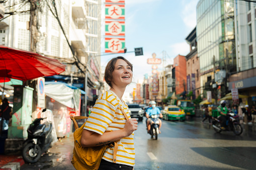 Young Caucasian woman exploring Chinatown in Bangkok, Thailand
