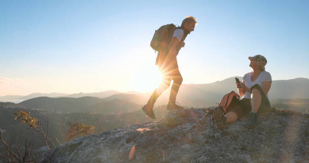 istock Mature hiking couple relax on mountain ridge crest 1805347114