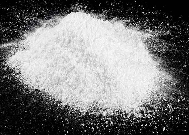 istock Pile of white fluffy snow isolated on dark background 1805347643