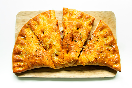 Delicious pizza puff isolated on white background.