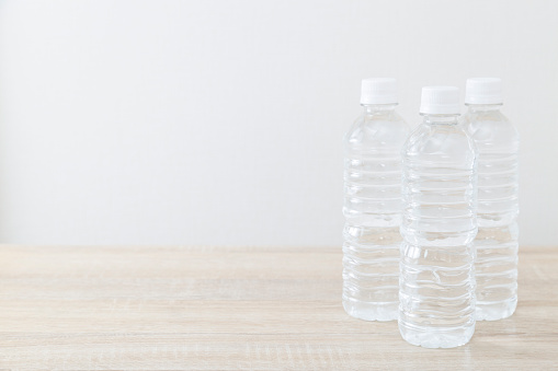 Plastic bottle of drinking water on the desk