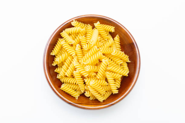 istock Short pasta fusilli on a white background. 1805357433