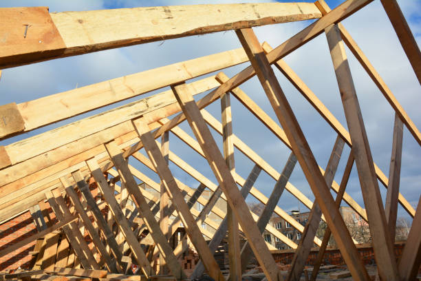 istock House roofing construction with wooden beams, trusses, wooden framework 1805364467