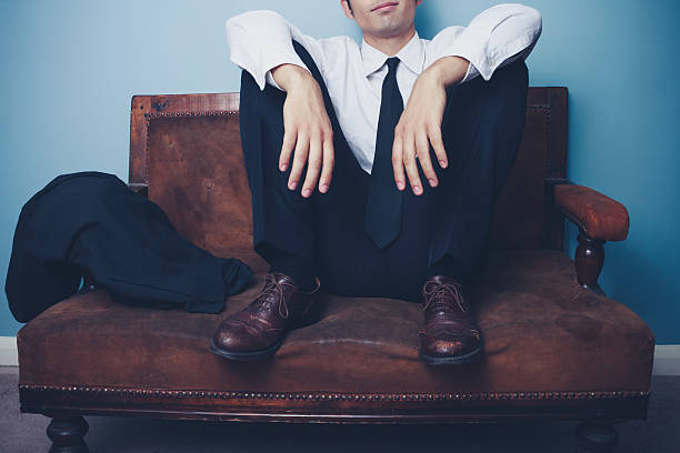 istock Businessman relaxing after long day at work 180537625