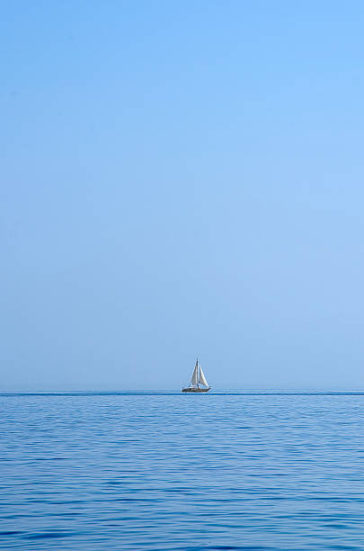istock Boat in blue sea 180537840