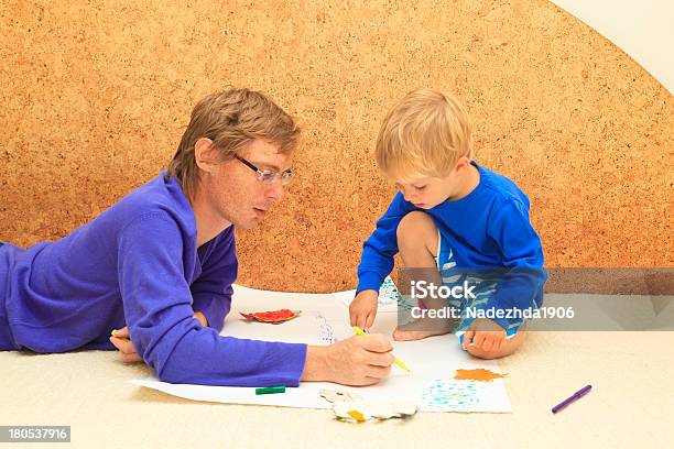 Father And Son Drawing Together Stock Photo - Download Image Now - Activity, Adult, Assistance