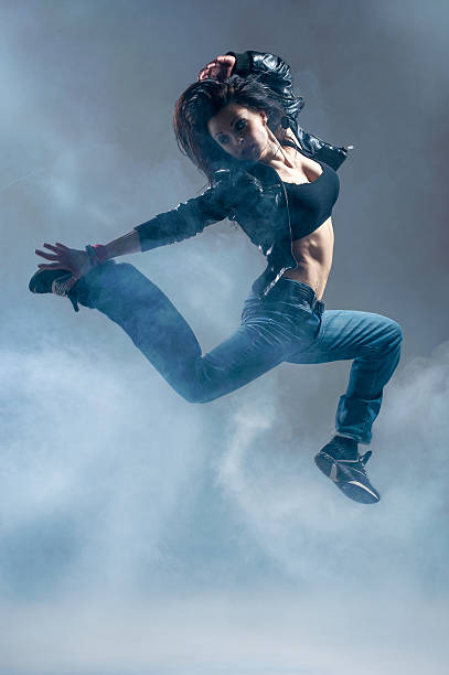 istock Brunett dancer. Woman dancing in a studio 180538629