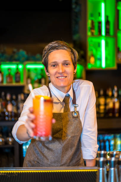 istock Bartender serving a luxury cocktail in the counter 1805386527