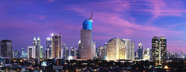 Jakarta City Sunset Cityscape of Jakarta, capital city of Indonesia at sunset jakarta skyline stock pictures, royalty-free photos & images