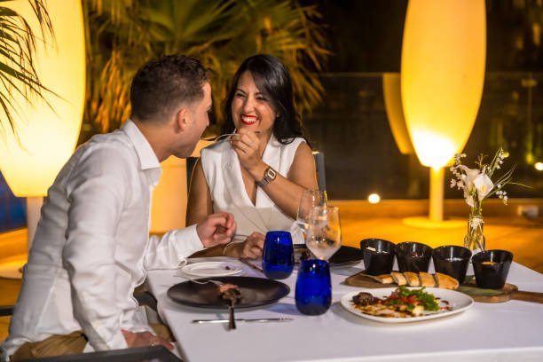istock Couple enjoying a romantic and luxury dinner outdoors 1805400593