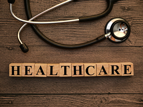 Healthcare, text words typography written on wooden letter, health and medical concept