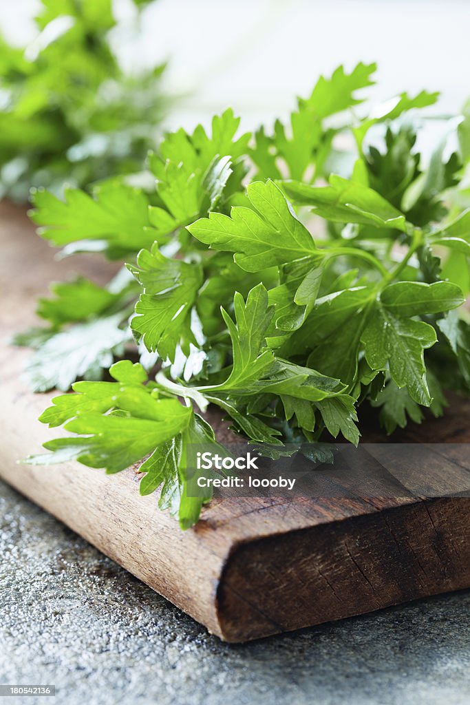 fresh parsley bunch of fresh parsley on a wooden board Bouquet Stock Photo