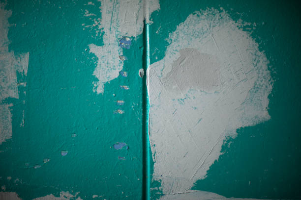 Rough textured wall with a beige plaster surface providing an abstract background