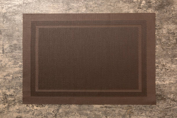 istock Top view of grey tablecloth for food on cement background. Empty space for your design 1805438853