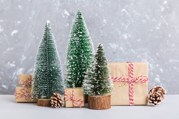 istock Christmas composition. Gifts, small tree, branches and craft DIY decorations on white background. New year concept. Christmas home decoration Flat lay, top view, copy space 1805439464