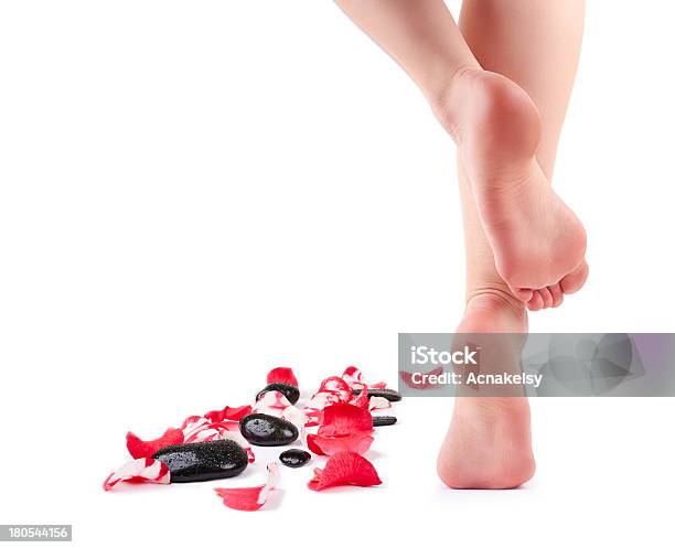 Female Feet And Spa Stones With Rose Petals Stock Photo - Download Image Now - Pedicure, Zen-like, Adult