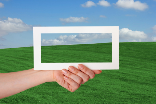 white paper in girl hand on natural background