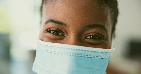Portrait, person and mask with closeup for virus, disease or illness with protection for safety in pandemic. Black woman, eyes and face with happiness for compliance, regulations or rules for covid