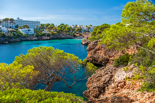 Turquoise waters and rocky coastline, Cala Esmerelda, Cala d'Or, Majorca Balearic Island