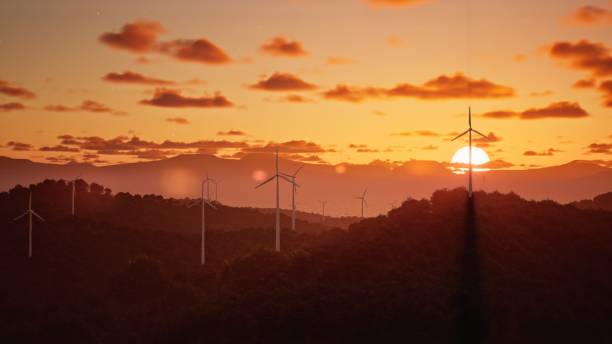 Free Stock Photo of Sunset over rolling hills with wind turbines ...