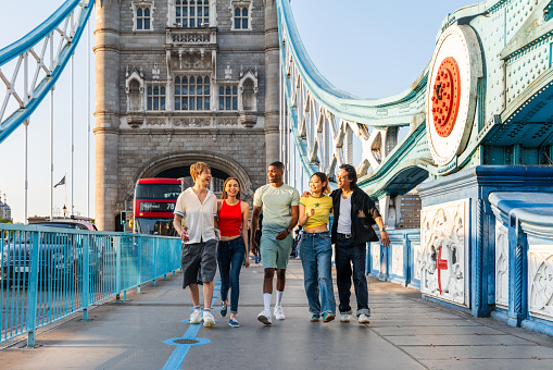 Multiracial group of happy young friends bonding in London city - Multiethnic teens students meeting and having fun in Tower Bridge area, UK - Concepts about youth lifestyle, travel and tourism