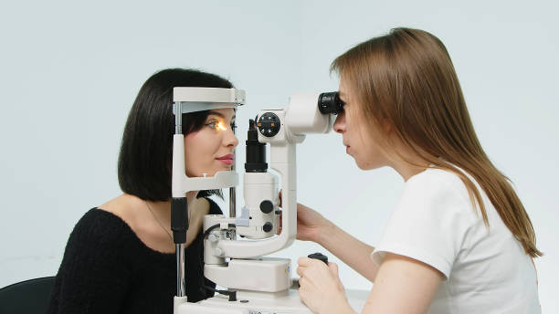istock An ophthalmologist checks a young woman's vision using modern equipment. Concept for advertising ophthalmic services and medical technologies. 1805503384