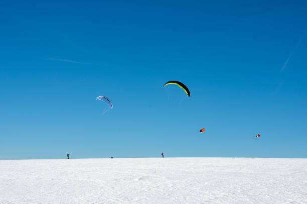 istock Kitesurfing in the snow with a blue sky 1805517099