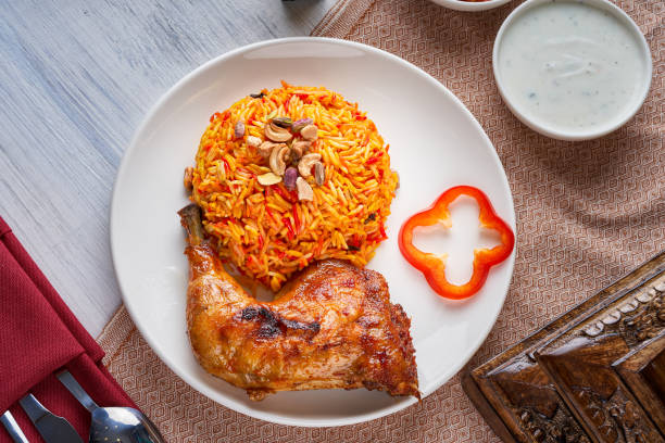 istock Mandi rice dish with grilled chicken 1805517529