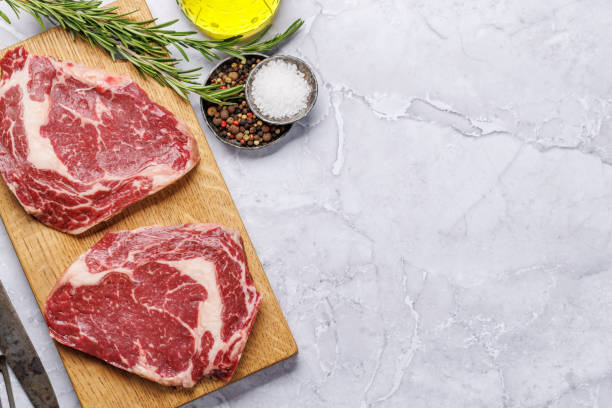 istock Raw ribeye steaks with savory spices 1805518276